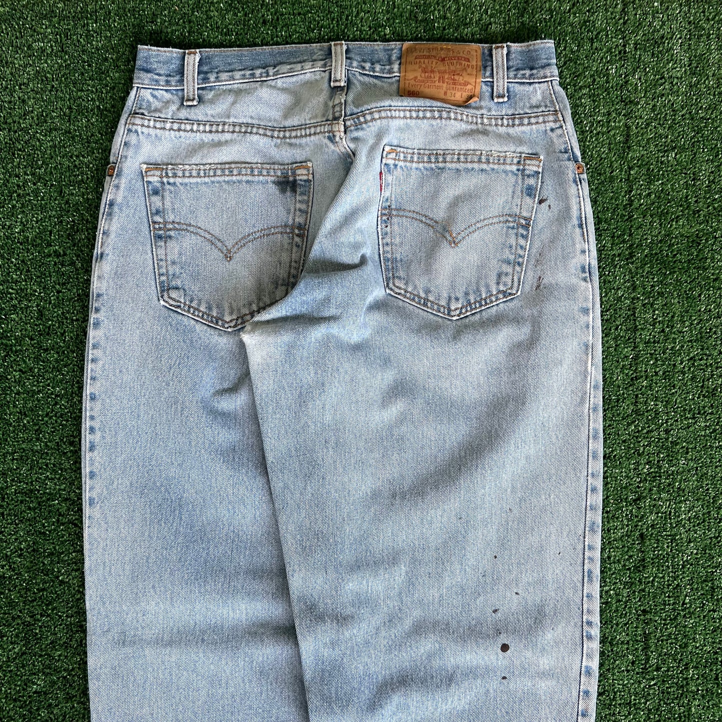 90s Levi's 560 Baggy Tapered Distressed Light Wash Blue Jeans - 34x33.5"