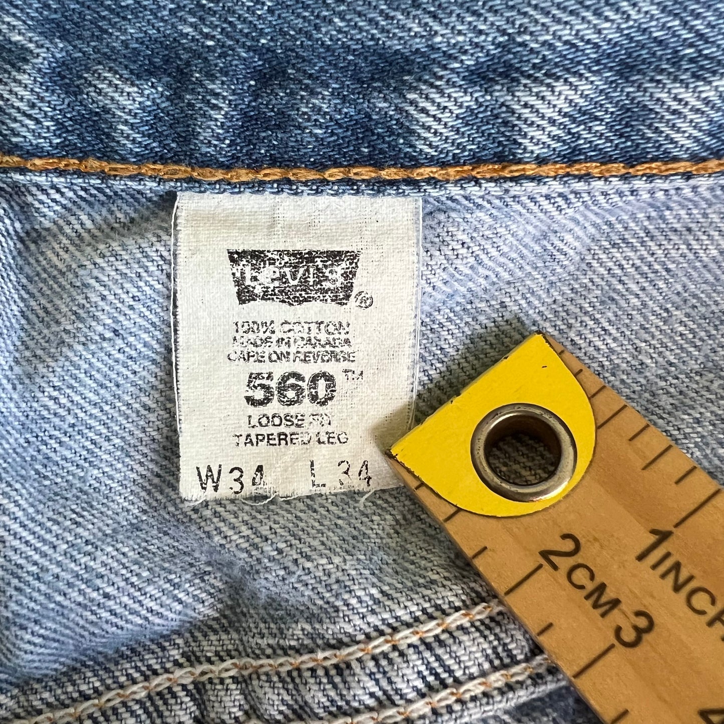 90s Levi's 560 Baggy Tapered Distressed Light Wash Blue Jeans - 34x33.5"