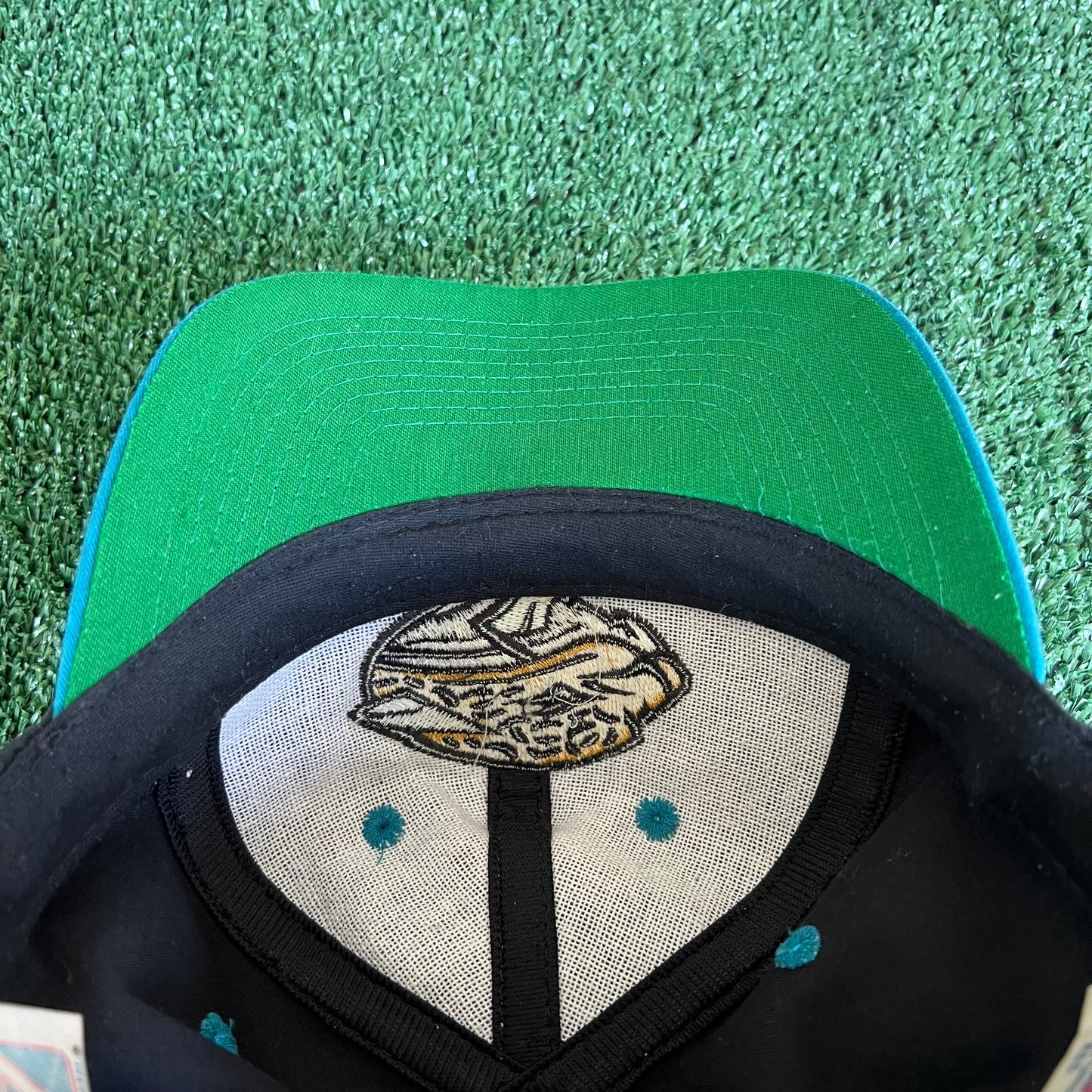 90s Logo 7 NFL Jacksonville Jaguars Black Snapback Hat