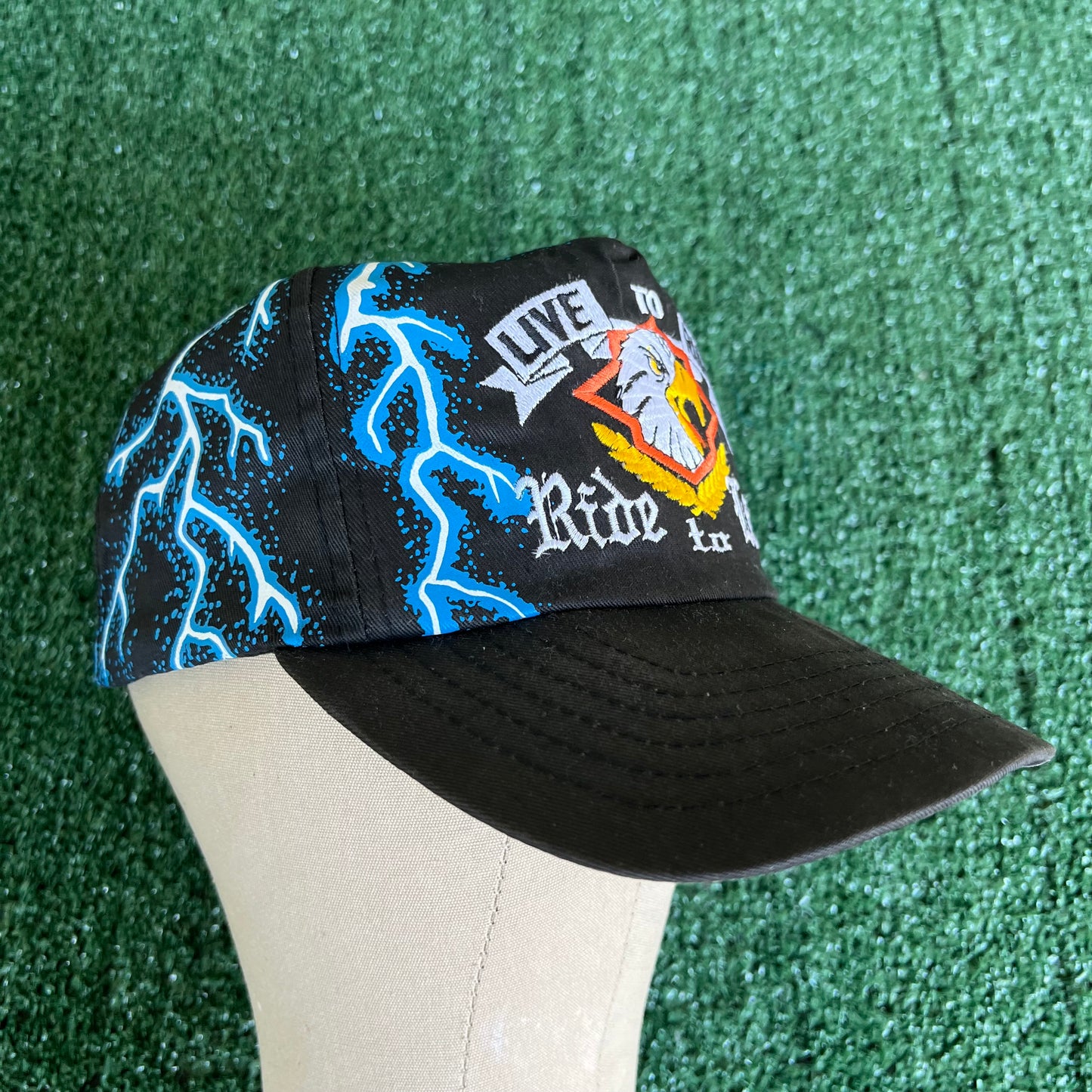 90s "Live to Ride Ride To Live" Bald Eagle AOP Faded Black Lightning Snapback Hat
