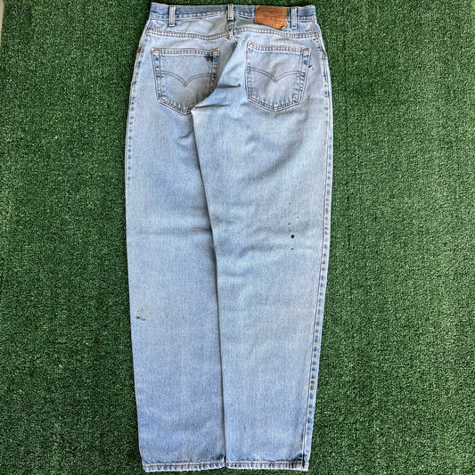90s Levi's 560 Baggy Tapered Distressed Light Wash Blue Jeans - 34x33.5"